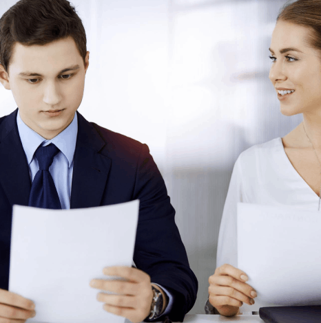 A corporate manager reviews bilingual contracts as Czech translation services keep clauses, tone, and layout consistent.