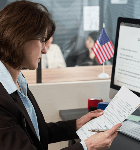 An attorney prepares a court filing with certified Pashto Translation Services, aligning seals and page formatting precisely.