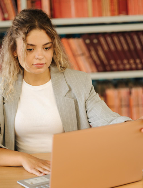 An evaluator compares a foreign degree with its English version from ATA certified translation services in New York.