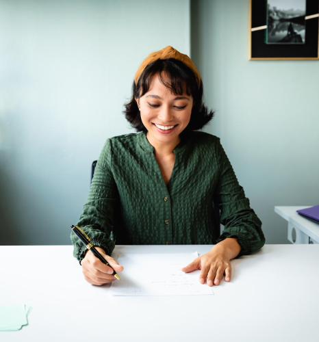 A credentialed linguist signs a certification letterhead for Drivers License Translation services in New York quality checks.