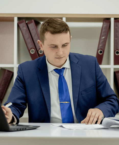A localization specialist checks a crypto exchange UI as fintech translation services adapt token labels for regional rules.
