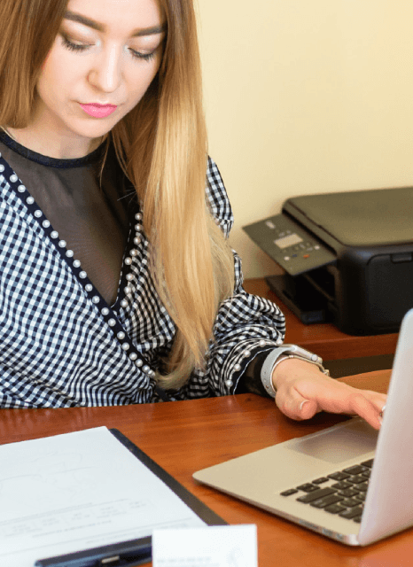 A specialist types cursive notebook pages into a Word file, using Copy typing services for handwritten notes.