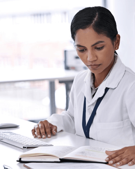 A clinician signs off an accurate discharge summary created from dictation with medical transcription services after rounds.