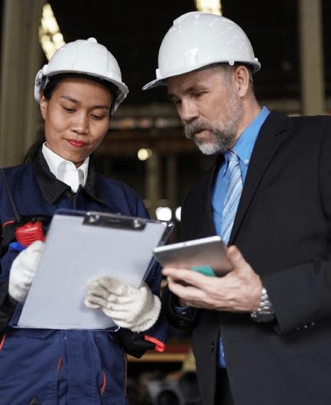 Engineers review a translated specification sheet, using manufacturing translation services for diverse audiences worldwide.
