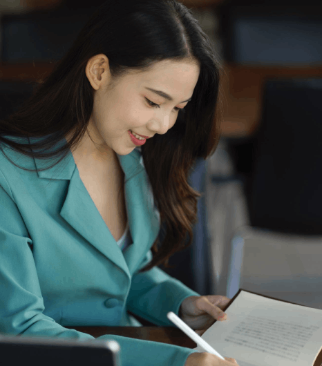 A paralegal checks a bilingual contract draft using Vietnamese Translation Services for legal business and personal files.