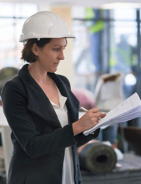 An EHS lead compares OSHA hazard sheets and a translation, using manufacturing translation services for regulatory.