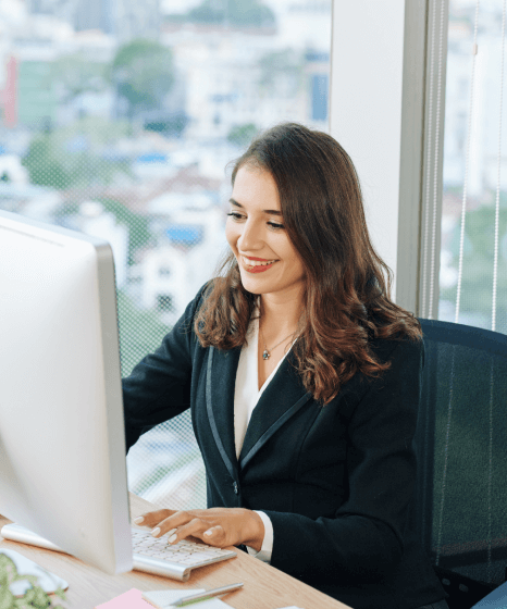 Typist using DTP typing services to format brochures, catalogs and reports for customers needing polished document layouts.