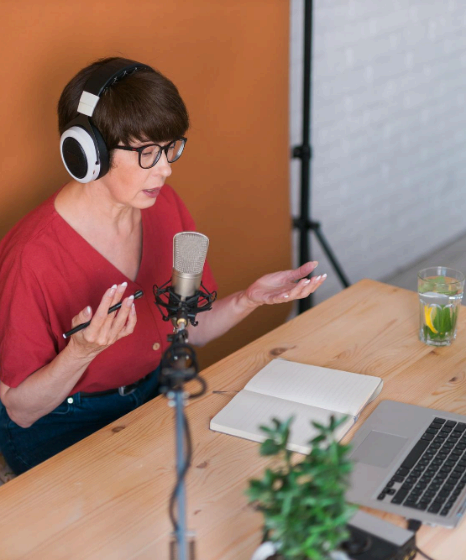 A presenter monitors webinar timings and audio meters, using language voice over services for education to keep learners.