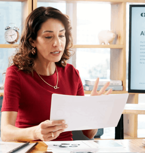 A client reviews certified PDFs for embassy submission while a linguist explains pdf translation services and compliance.