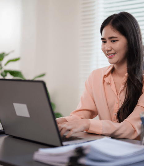  A project lead checks PDF and InDesign files as Catalog Translation Services retain file formats and page layout.