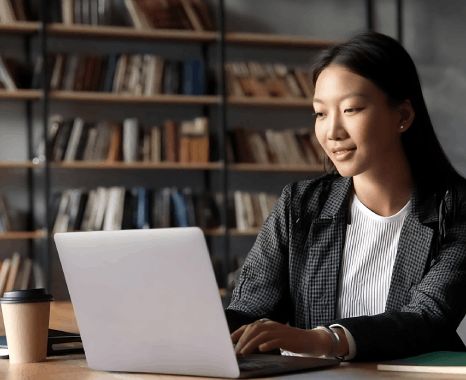 A researcher edits a thesis translation with russian translation services new york, checking citations and academic terms.