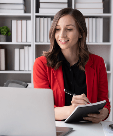  A linguist builds a foreign language glossary on a laptop while Book Translation Services keep character voices consistent.