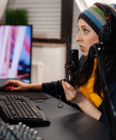 A game developer directs multilingual actors in a studio session, using video game voice over services for global releases.