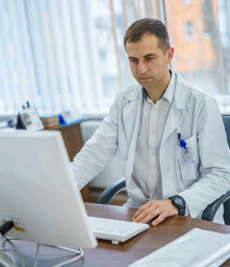 Doctor using Haitian Creole translations of medical records, improving patient communication and care in New York City.