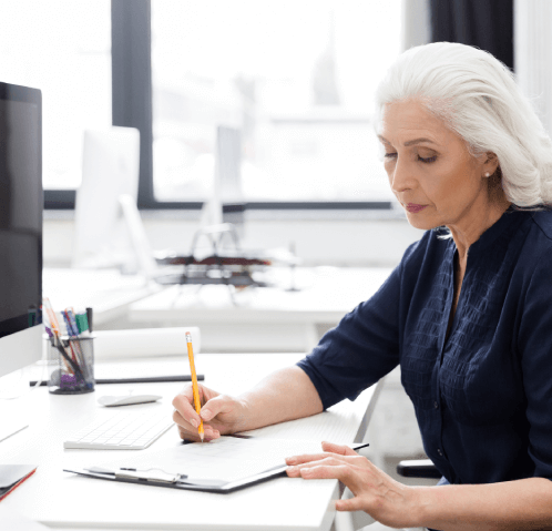Senior using handwritten document typing service to convert old letters into digital format with professional typist