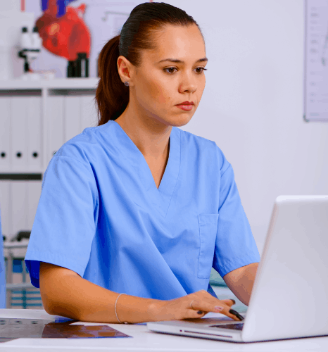 A nurse scans patient charts while one hour translation services provide healthcare-specific medical record translations.
