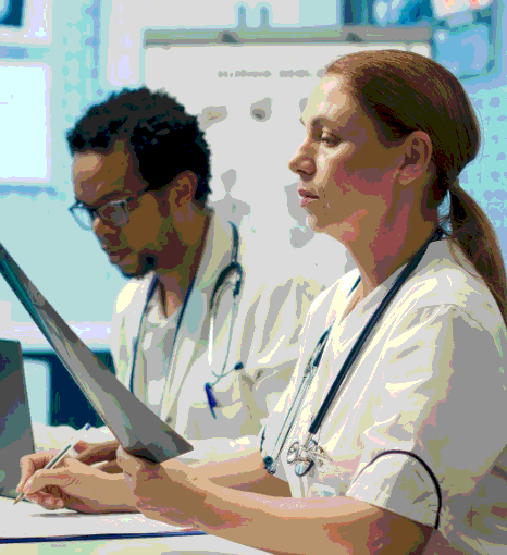 Clinicians watch a translated device training video as medical device translation services in New York support healthcare.