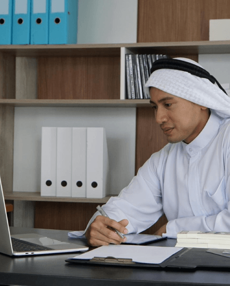 A linguist delivers Urdu Translation Services, reviewing a client file under an NDA to ensure accurate, confidential wording.
