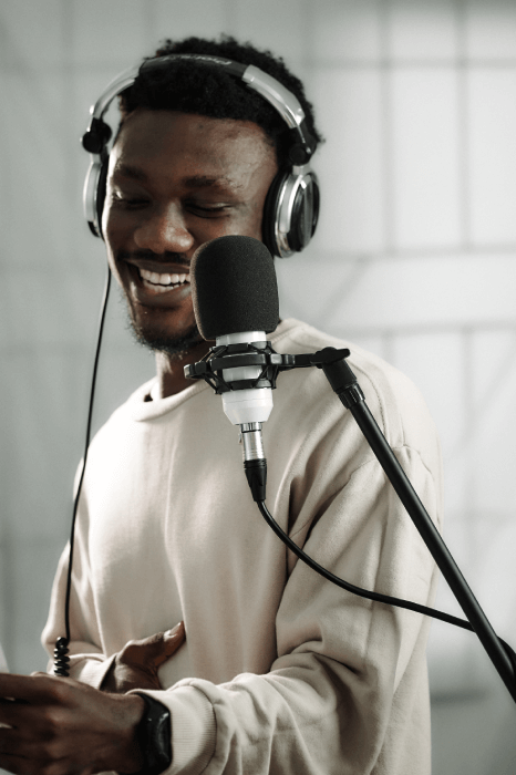 A deep voice actor recording high-quality voice-over for a client.
