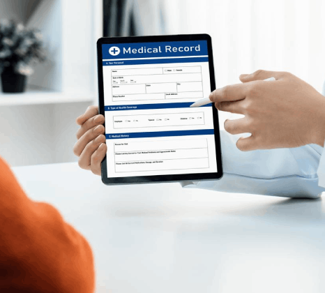 A hospital admin reviews bilingual consent forms for certified vital document translation, keeping signatures aligned.