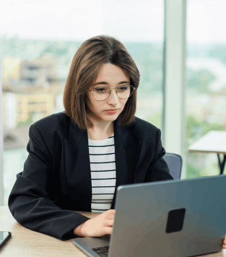 An HR lead reviews a multilingual staff update draft, using newsletter translation services to keep policy details clear.