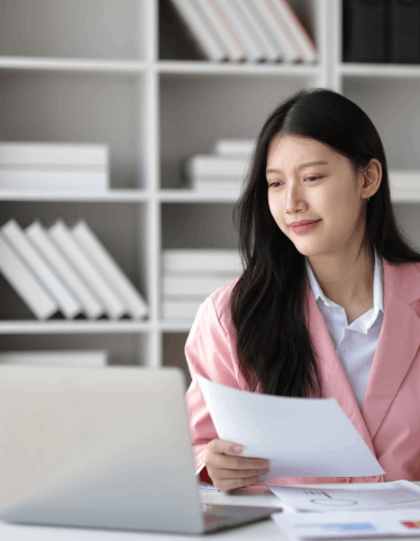 An editor marks tracked changes during human review as immediate translation services verify accuracy before delivery.