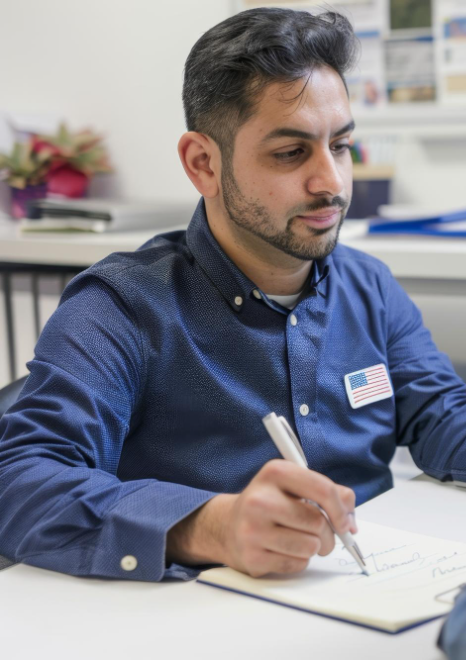 A translator checks names and seals on birth and marriage certificates for immigration, using Turkish Translation Services.
