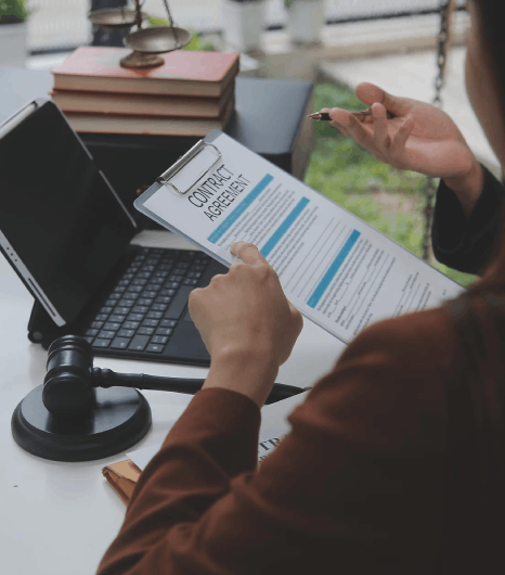 A translator verifies seals on a marriage certificate as Ukrainian Translation Services finalize an immigration submission.