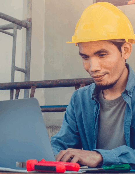 An engineer checks a bilingual manufacturing update, using newsletter translation services with industry terminology notes.