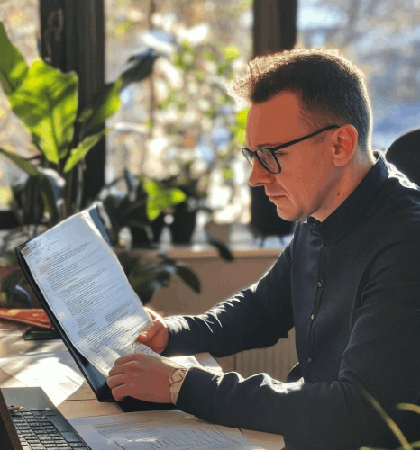 An engineer marks a Romanian manual with terminology notes, applying industry Romanian translation services for accuracy.