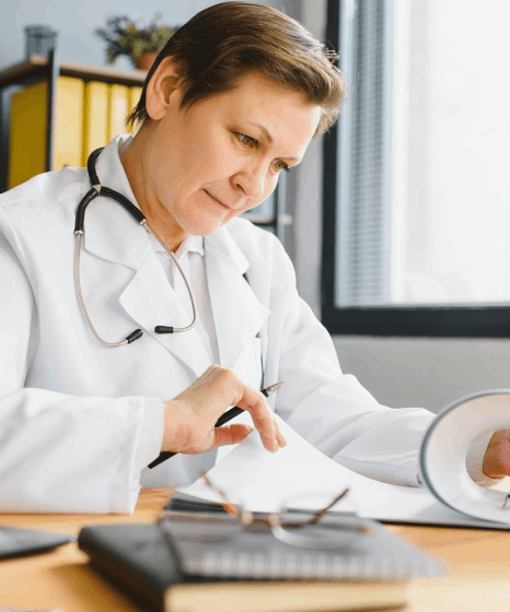 A healthcare specialist reviews a translated patient chart, using Serbian translation services for industry terminology.