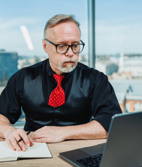 A compliance manager compares certified Danish policy text, using Danish translation services to meet regulated standards.