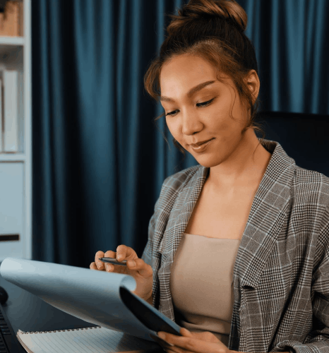 An engineer reviews a terminology glossary, using Kazakh translation services for industry-specific technical documents.