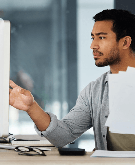 An engineer reviews a technical diagram as Marathi translation services deliver industry-specific terminology and labels.