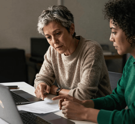 A nonprofit team reviews sector glossaries, using translation services for non-profit programs in healthcare and education.