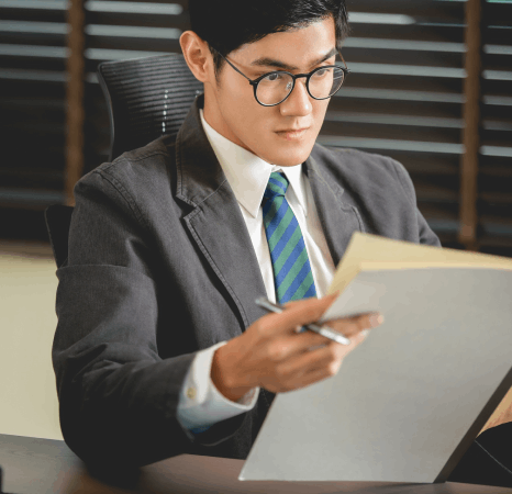 A project manager compares industry terms in Vietnamese Translation Services files to keep product language consistent.