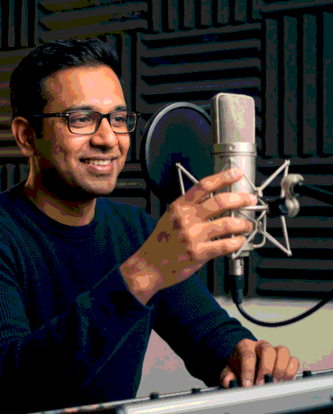 An audio engineer mixes a training module for Vietnamese Voice Over Services, balancing music and clear narration.