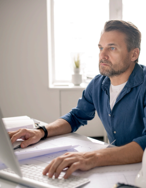 A compliance editor compares a regulation excerpt to localized web copy, using website translation services for clarity.