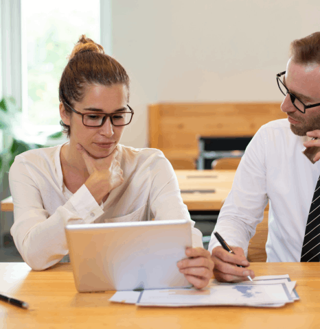 A team lead formats an internal memo as Afar translation services keep terminology consistent across departments.