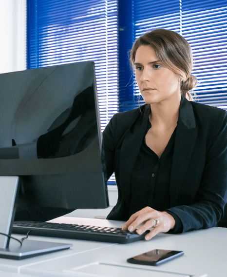 A finance lead reviews bilingual audit notes using Accounting Translation Services for international business reporting.