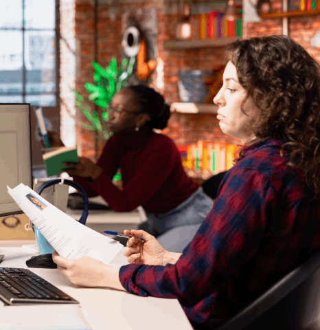 An editor checks an academic journal article as machine translation services maintain formatting, quotes, and references.