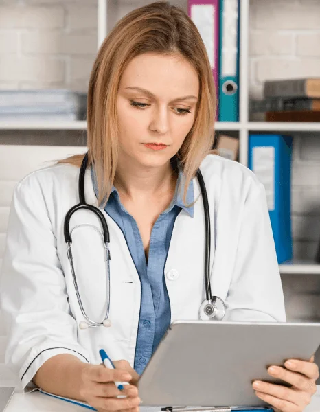 Doctor reviews a translated lab report on a tablet, relying on fast translation services before a visit.