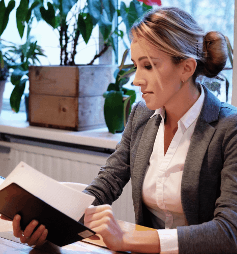 A specialist compares an official form PDF as machine translation services preserve layout, headings, and required fields.