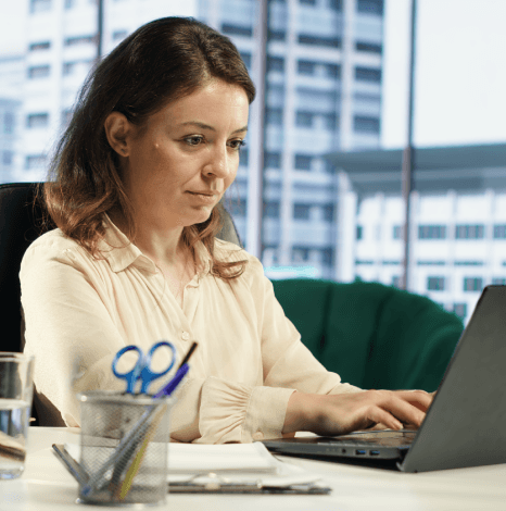 A specialist applies structured formatting in Manuscript Typing Services, aligning headings, margins and spacing for review.