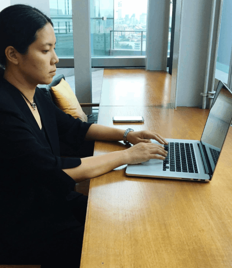 A translator checks layout after Tagalog Translation Services so Tagalog-to-English documents keep the same format.