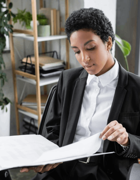 A paralegal checks court forms beside certified vital document translation pages, confirming legal filings are complete.