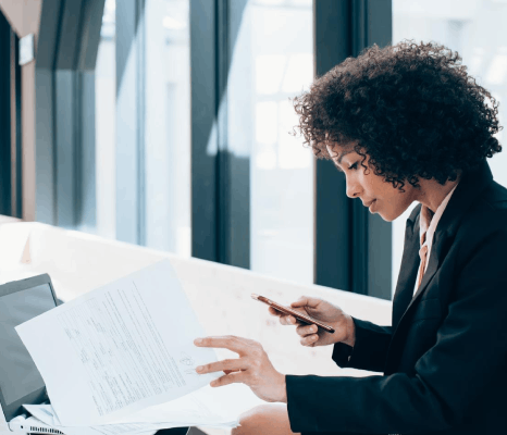 A paralegal prepares agency forms with certified translations, using chinese translation services new york for legal review.