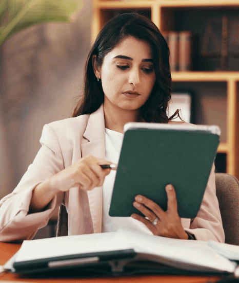 A translator aligns a legal contract and its Hindi version, using Hindi Translation Services for diverse content types.