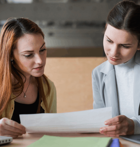 A legal linguist compares a Norwegian contract clause by clause, using Norwegian translation services to match legal terms.