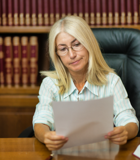 Lawyer checks a certified packet for proceedings, using USCIS Certified Translation services in New York for legal use.